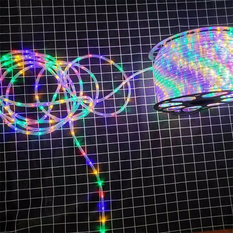 Multicolored LED strip light on a black grid background