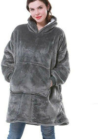 Person wearing a gray fleece blanket hoodie on a white background